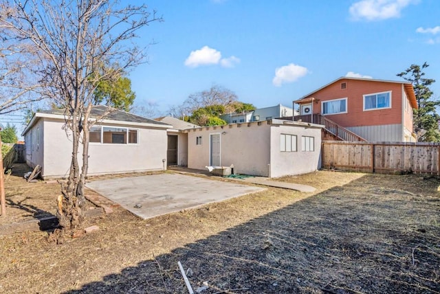 rear view of house featuring a patio