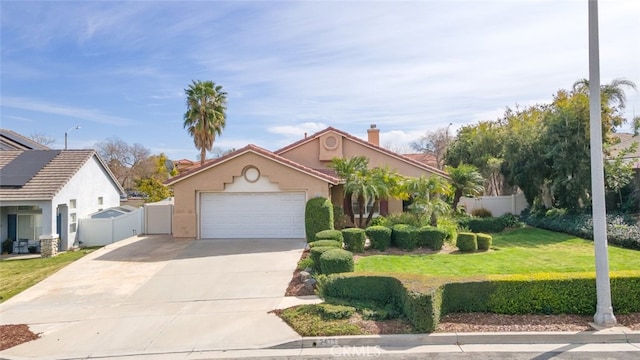 view of front facade featuring a garage, driveway, stucco siding, fence, and a front yard