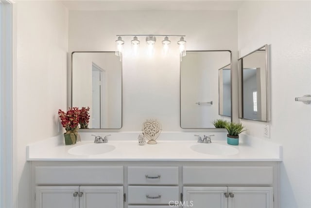 bathroom with double vanity and a sink