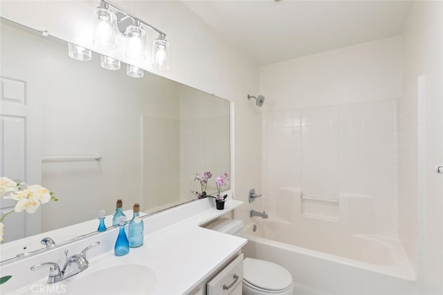 bathroom featuring bathtub / shower combination, vanity, and toilet