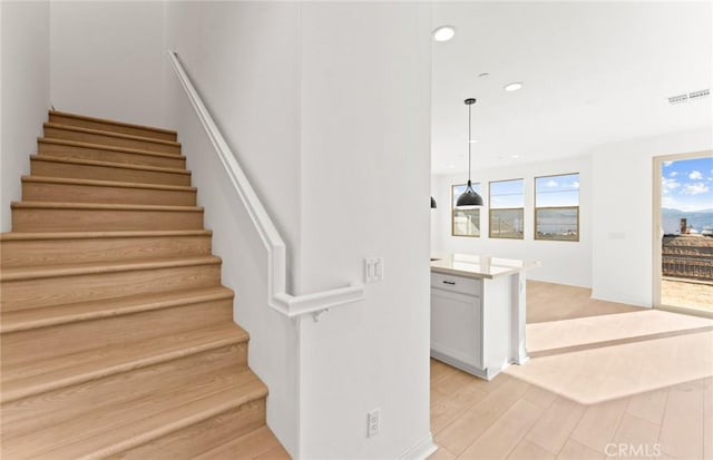 stairway featuring hardwood / wood-style floors