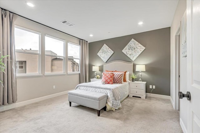 bedroom with light colored carpet