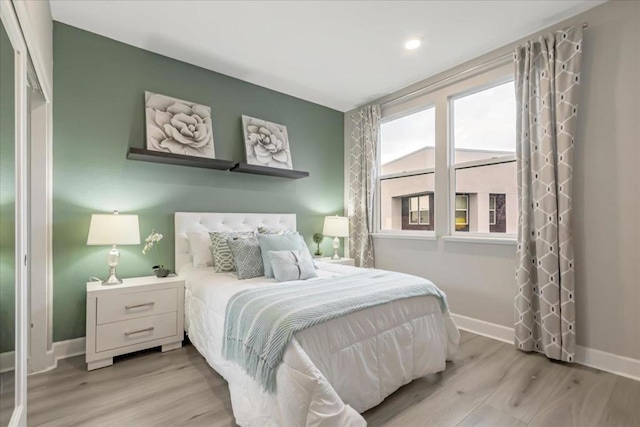 bedroom featuring light wood-type flooring