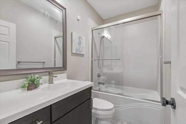 full bathroom with toilet, vanity, and shower / bath combination with glass door