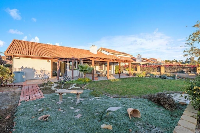 back of house featuring a patio, central AC unit, and a lawn