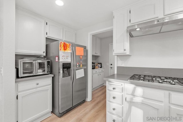 kitchen featuring white cabinetry, stainless steel appliances, and light hardwood / wood-style floors