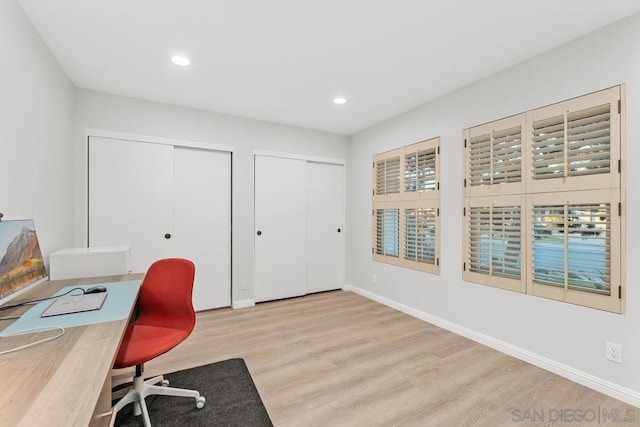 office with light hardwood / wood-style floors