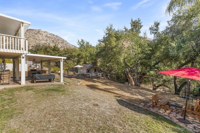 view of yard featuring a patio, a mountain view, and outdoor lounge area