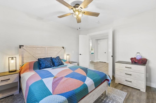 bedroom featuring dark wood-type flooring and ceiling fan