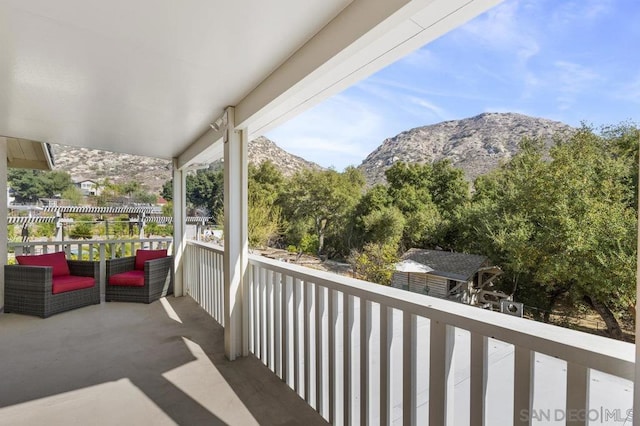 balcony featuring a mountain view