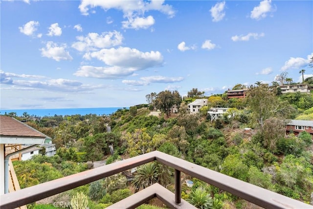 balcony featuring a water view