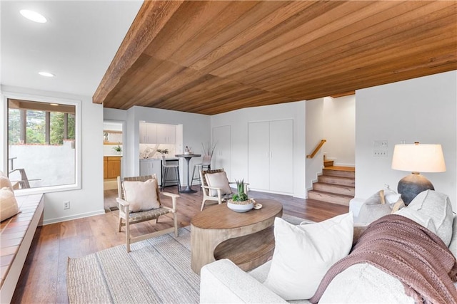 living room with baseboards, wooden ceiling, stairway, light wood-type flooring, and recessed lighting