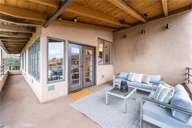 view of patio / terrace with a balcony and an outdoor hangout area