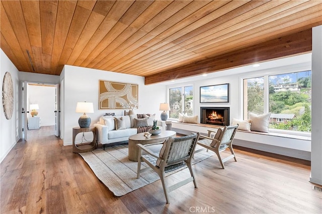 sunroom / solarium featuring wood ceiling