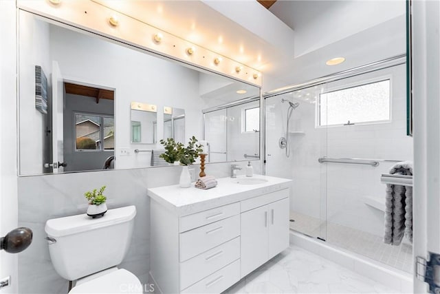 full bath with marble finish floor, vanity, a shower stall, and toilet