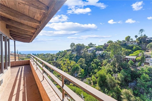 balcony featuring a water view