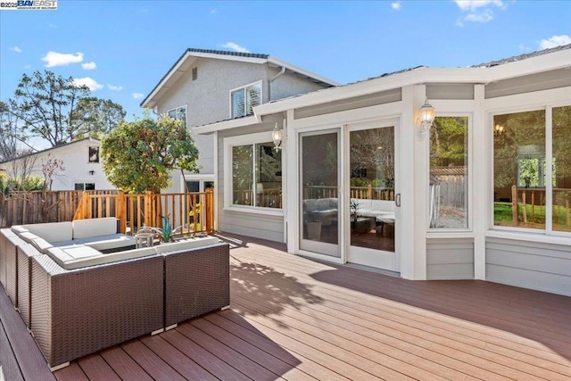 wooden deck with an outdoor living space