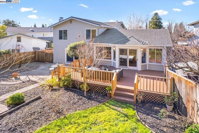 rear view of house with a deck