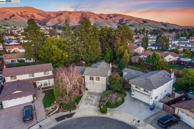 aerial view at dusk with a mountain view