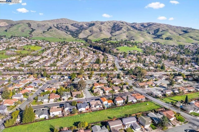 birds eye view of property featuring a mountain view