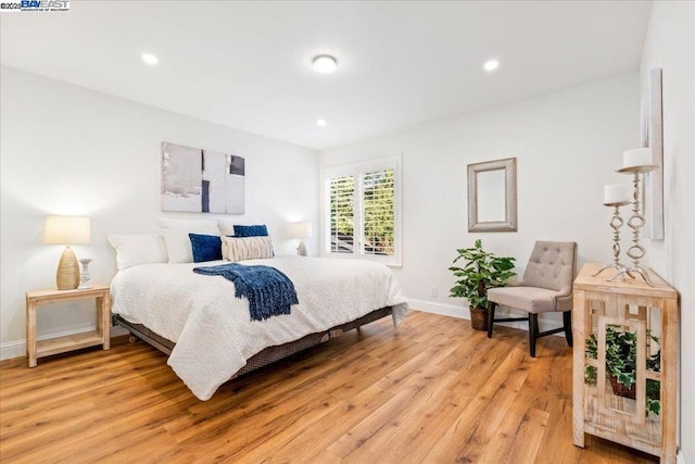 bedroom with light hardwood / wood-style flooring