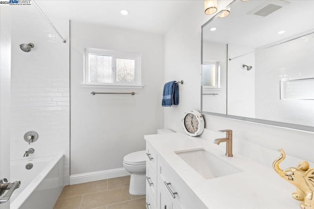 full bathroom featuring tile patterned flooring, tiled shower / bath combo, a wealth of natural light, and toilet