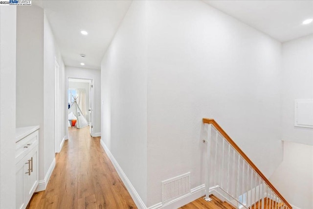 hall with light hardwood / wood-style floors