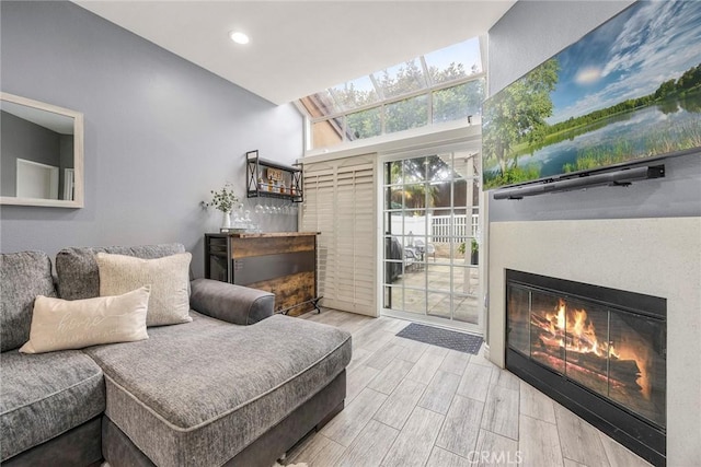 living room with lofted ceiling and hardwood / wood-style floors