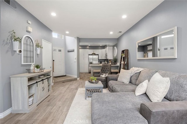 living room with light hardwood / wood-style floors