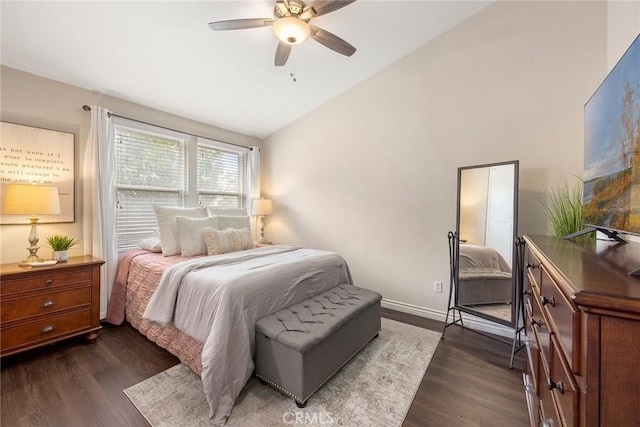 bedroom with baseboards, lofted ceiling, a ceiling fan, and dark wood-style flooring