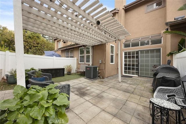 view of patio with central AC and a pergola