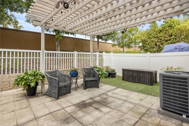 view of patio with cooling unit and a pergola