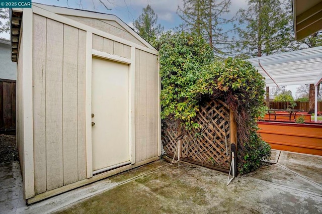 view of outdoor structure with a pergola