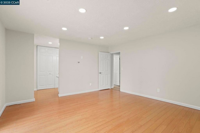 unfurnished room featuring light wood-type flooring