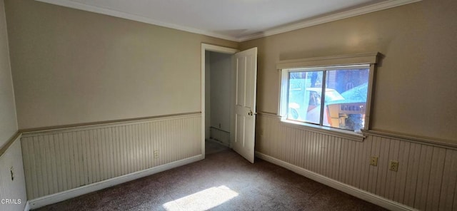 unfurnished bedroom with ornamental molding and carpet