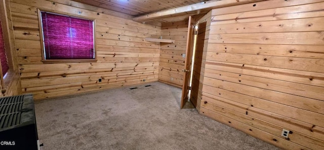 interior space with wooden walls and light carpet