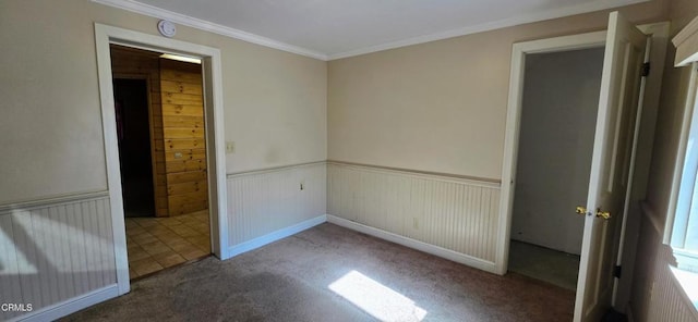 carpeted empty room with crown molding