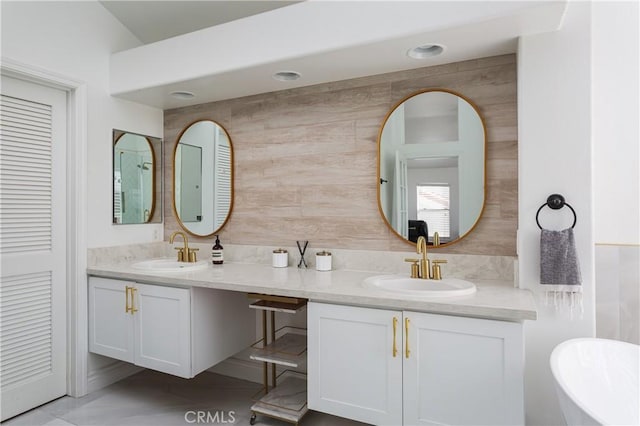 bathroom featuring vanity and a bathtub