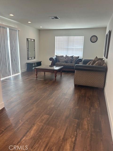 living room featuring dark hardwood / wood-style floors