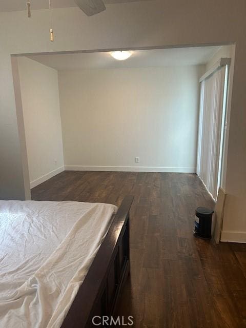 unfurnished bedroom featuring dark hardwood / wood-style floors