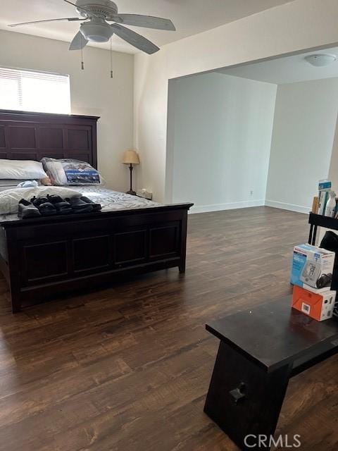 bedroom featuring ceiling fan and dark hardwood / wood-style flooring