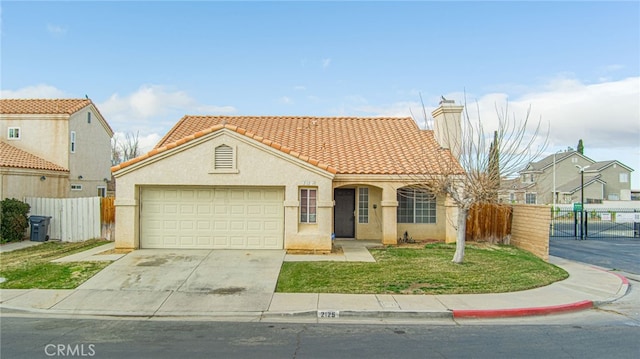 mediterranean / spanish-style house with a garage