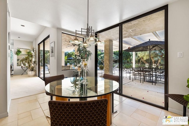 dining room featuring floor to ceiling windows and light tile patterned floors