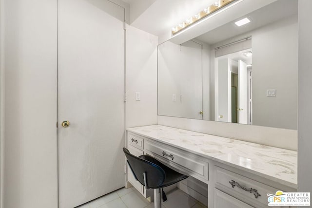 bathroom with tile patterned flooring and vanity