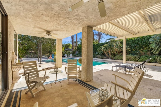 view of patio / terrace with ceiling fan and a pergola