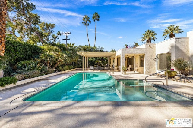 view of swimming pool featuring a pergola and a patio area