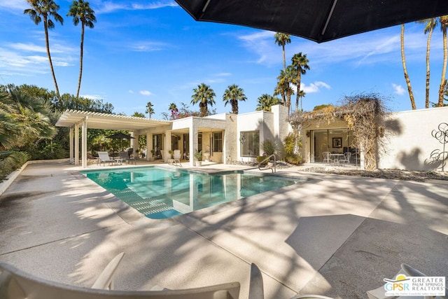 view of pool with a patio area and a pergola