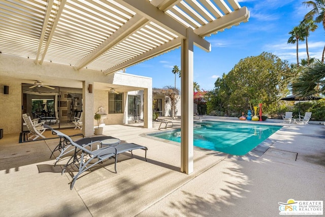 view of pool with ceiling fan, a pergola, and a patio area