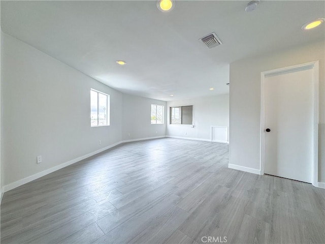 spare room featuring light hardwood / wood-style floors