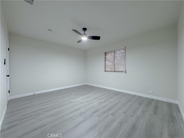 unfurnished room featuring ceiling fan and light wood-type flooring